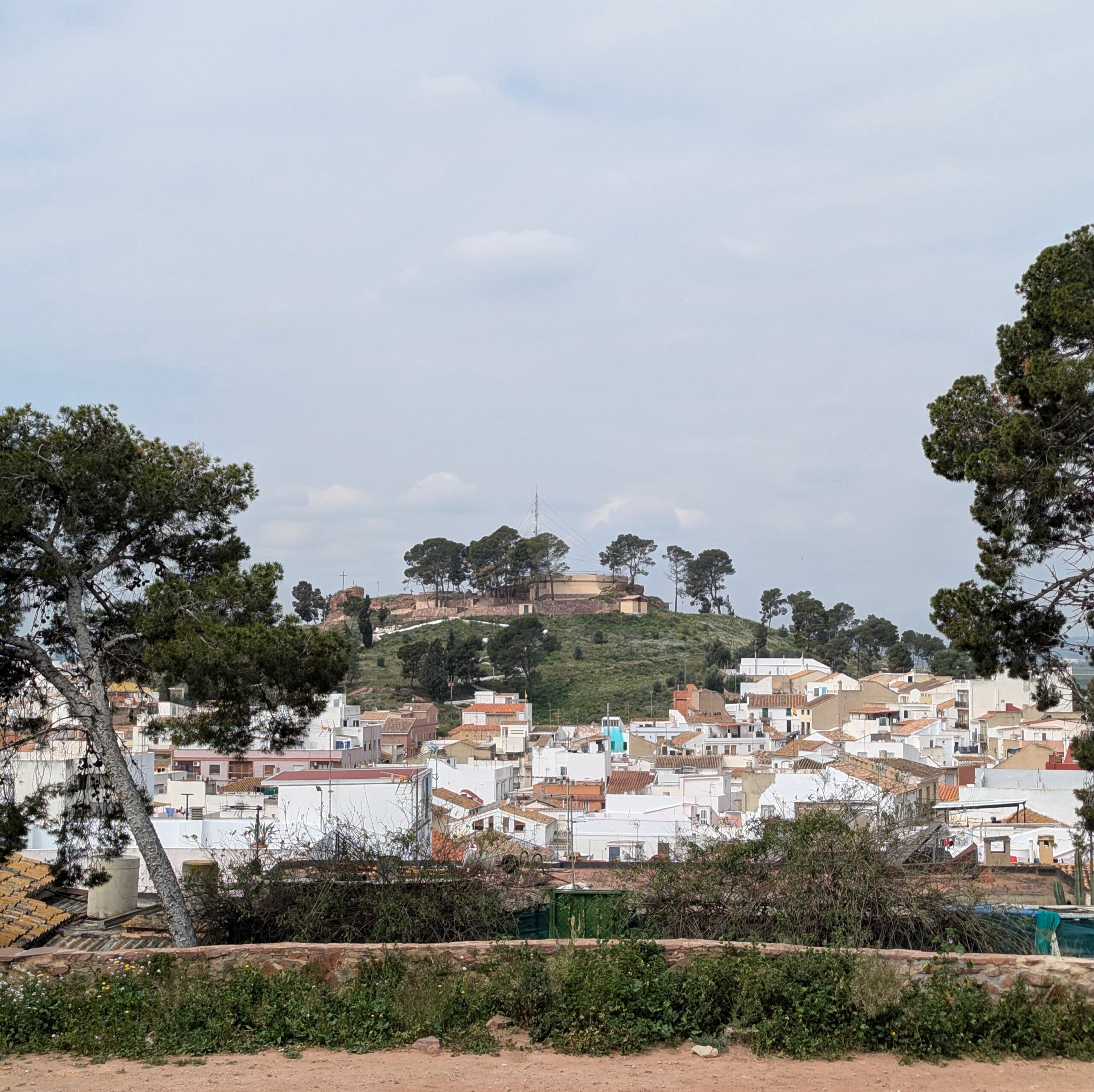 The castle hill of Puig de Santa Maria, with the village in the foreground.